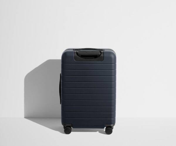 The Bigger Carry-On Flex in Navy Blue